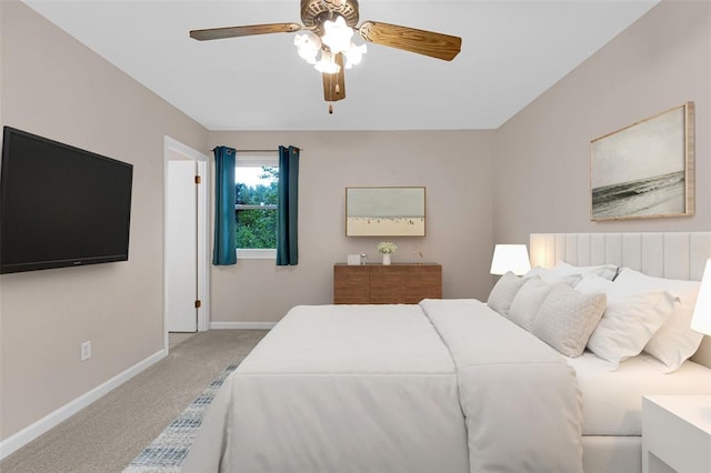 bedroom featuring carpet floors, baseboards, and a ceiling fan