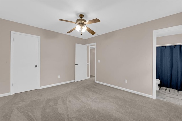 unfurnished bedroom featuring carpet and baseboards