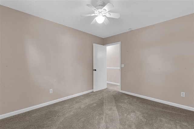 unfurnished room featuring ceiling fan, carpet flooring, and baseboards