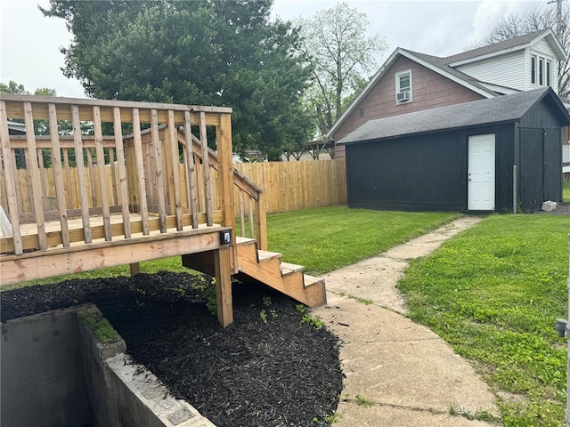 view of yard featuring a wooden deck and an outdoor structure