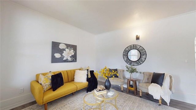 living area with wood finished floors and baseboards