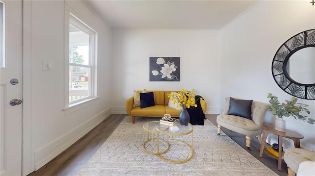 sitting room with wood finished floors and baseboards