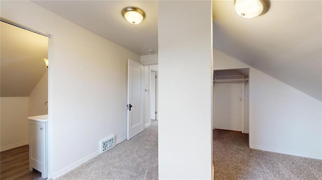 bonus room featuring carpet, baseboards, and lofted ceiling