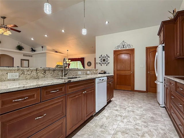 kitchen with white appliances, a sink, ceiling fan, lofted ceiling, and decorative light fixtures