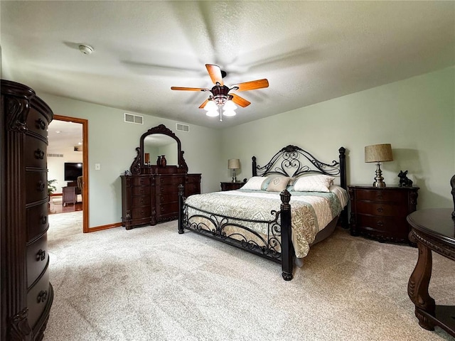 bedroom with light colored carpet and ceiling fan