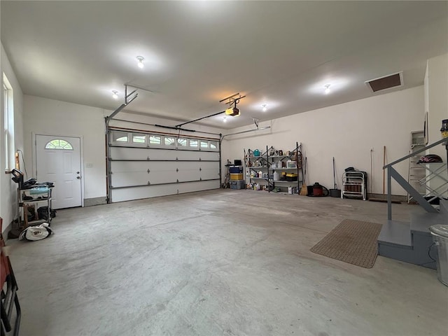 garage featuring a garage door opener