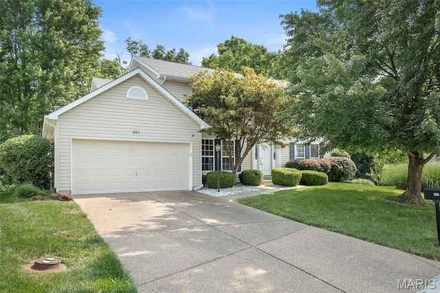 881 Sara Beth Ct, Saint Peters, MO 63376 - obstructed view of property featuring concrete driveway, a garage, and a front lawn