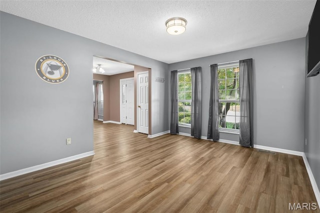 881 Sara Beth Ct, Saint Peters, MO 63376 - spare room with wood finished floors and a textured ceiling