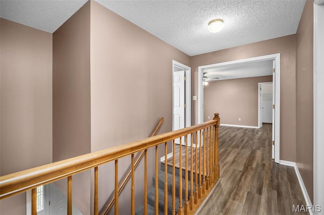 881 Sara Beth Ct, Saint Peters, MO 63376 - corridor featuring an upstairs landing, a textured ceiling, and wood finished floors