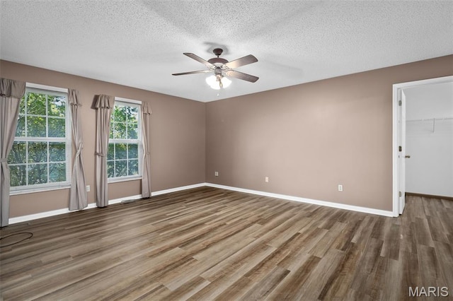 881 Sara Beth Ct, Saint Peters, MO 63376 - empty room with wood finished floors, ceiling fan, and a textured ceiling