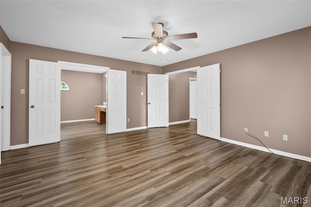 881 Sara Beth Ct, Saint Peters, MO 63376 - unfurnished bedroom with wood finished floors, a ceiling fan, and connected bathroom