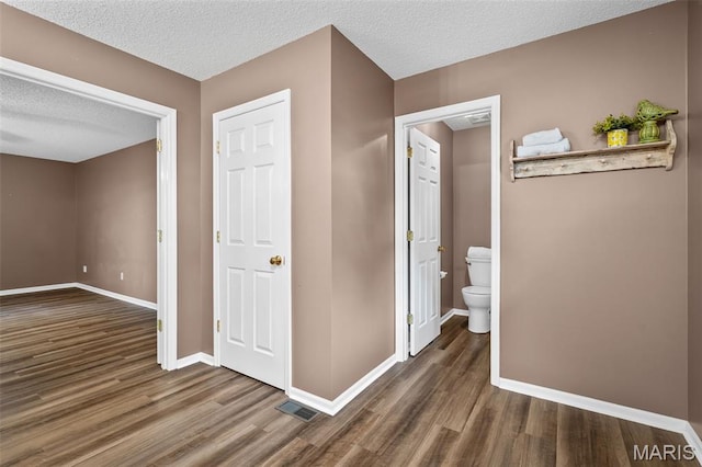 881 Sara Beth Ct, Saint Peters, MO 63376 - corridor with wood finished floors and a textured ceiling
