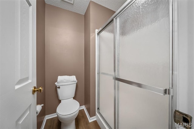 881 Sara Beth Ct, Saint Peters, MO 63376 - bathroom with wood finished floors, a shower stall, and a textured ceiling