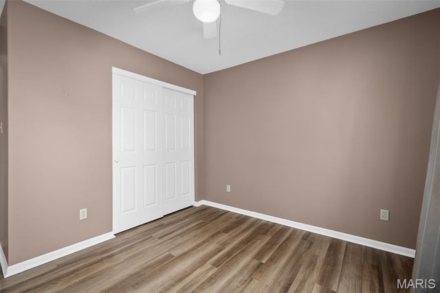 881 Sara Beth Ct, Saint Peters, MO 63376 - unfurnished bedroom featuring wood finished floors, a closet, and ceiling fan