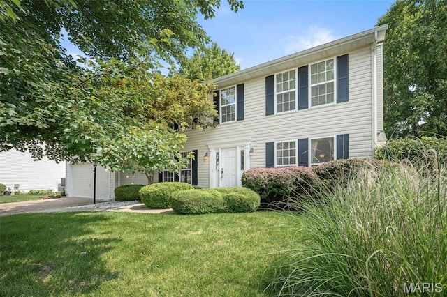 881 Sara Beth Ct, Saint Peters, MO 63376 - colonial house featuring driveway, a front lawn, and an attached garage