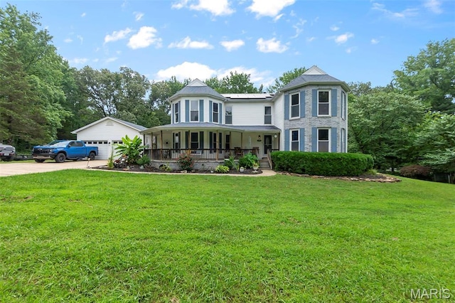 15092 State Highway Ad, Dexter, MO 63841 - victorian home featuring a porch, a front yard, and a detached garage