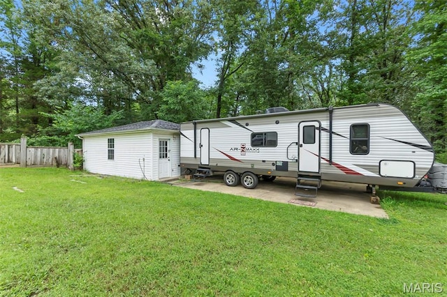15092 State Highway Ad, Dexter, MO 63841 - rear view of property featuring entry steps, an outbuilding, and view of scattered trees