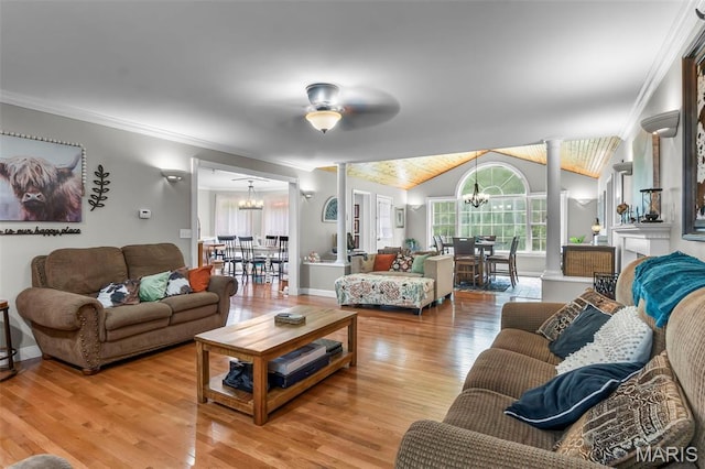 15092 State Highway Ad, Dexter, MO 63841 - living room featuring a chandelier, light wood-type flooring, vaulted ceiling, crown molding, and a ceiling fan