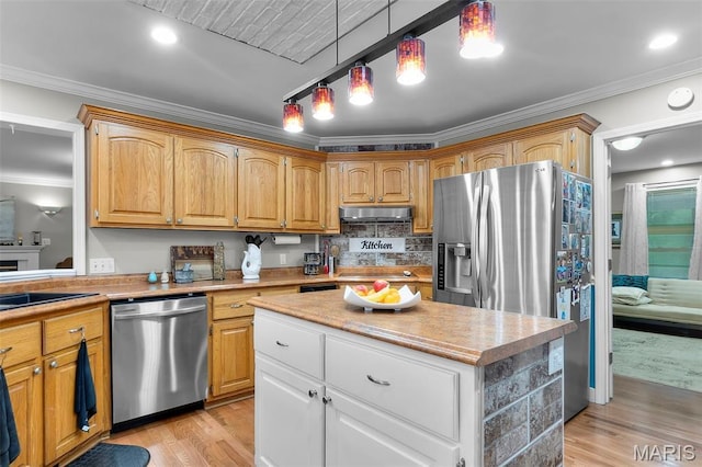 15092 State Highway Ad, Dexter, MO 63841 - kitchen with stainless steel appliances, under cabinet range hood, crown molding, light wood finished floors, and light countertops