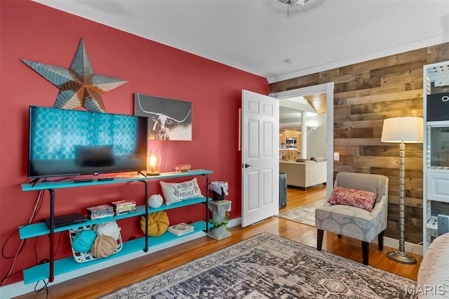 15092 State Highway Ad, Dexter, MO 63841 - living area featuring an accent wall, wooden walls, and wood finished floors