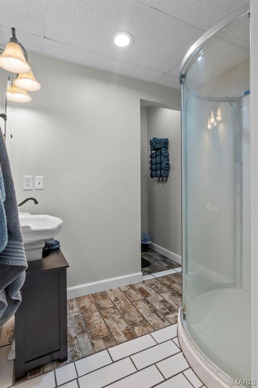 15092 State Highway Ad, Dexter, MO 63841 - bathroom with a shower stall, vanity, and a paneled ceiling