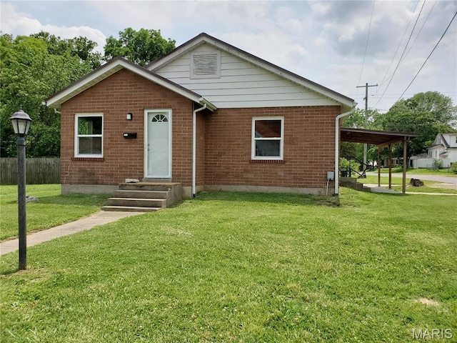 1225 Bloomfield Rd, Cape Girardeau, MO 63703 - view of front facade with brick siding and a carport