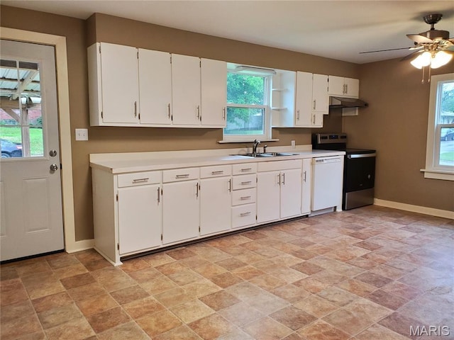 1225 Bloomfield Rd, Cape Girardeau, MO 63703 - kitchen with electric stove, stone finish flooring, baseboards, white dishwasher, and a sink