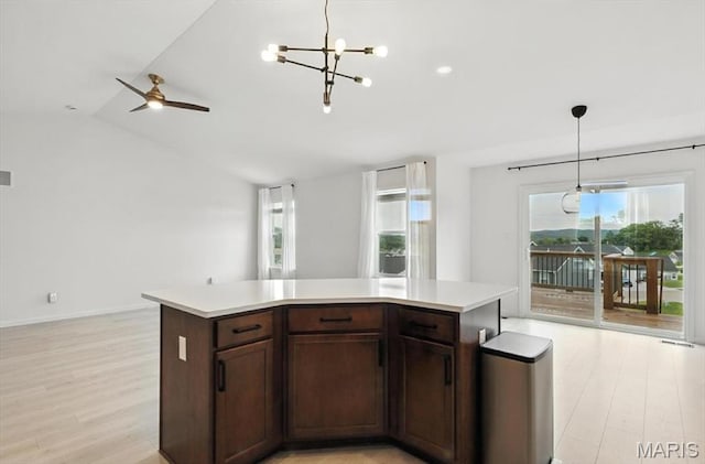2112 Windswept Farms Dr, Eureka, MO 63025 - kitchen with light wood-style flooring, open floor plan, light countertops, and vaulted ceiling