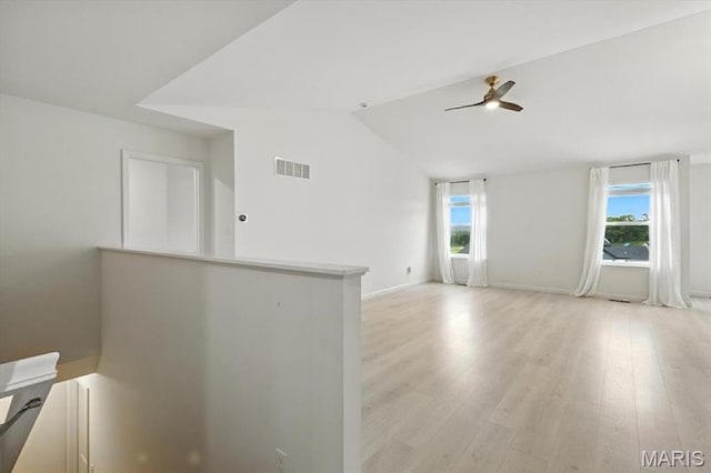 2112 Windswept Farms Dr, Eureka, MO 63025 - spare room with healthy amount of natural light, ceiling fan, light wood-style flooring, and lofted ceiling