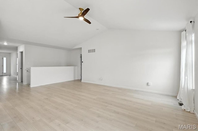 2112 Windswept Farms Dr, Eureka, MO 63025 - unfurnished living room with ceiling fan, lofted ceiling, and light wood finished floors