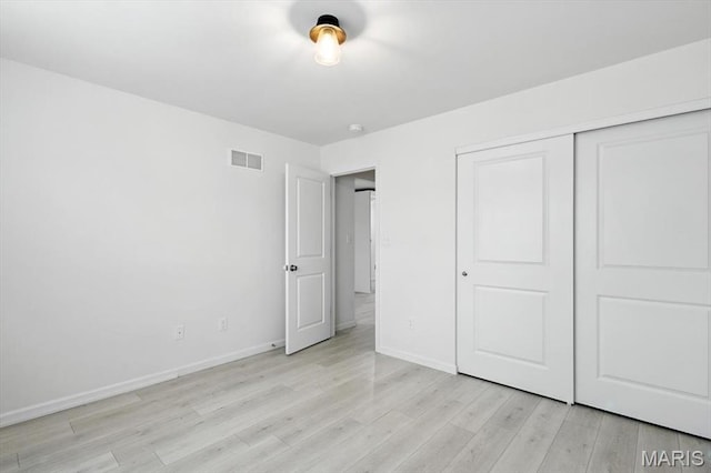 2112 Windswept Farms Dr, Eureka, MO 63025 - unfurnished bedroom featuring light wood finished floors and a closet