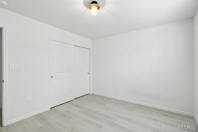 2112 Windswept Farms Dr, Eureka, MO 63025 - unfurnished bedroom with light wood-style flooring and a closet