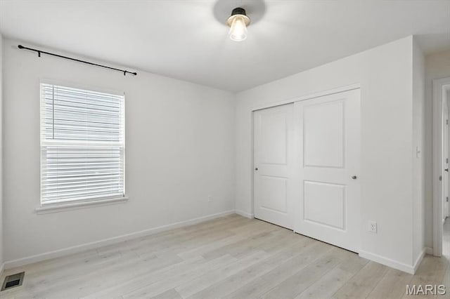 2112 Windswept Farms Dr, Eureka, MO 63025 - unfurnished bedroom with light wood finished floors and a closet