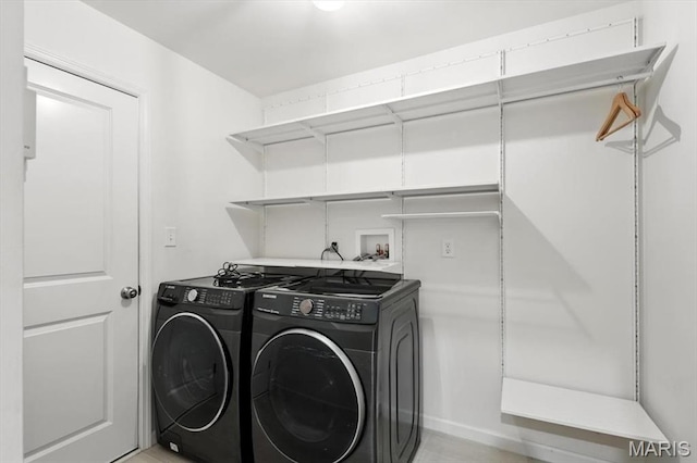 2112 Windswept Farms Dr, Eureka, MO 63025 - washroom featuring washer and clothes dryer and baseboards