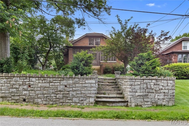 870 Tuxedo Blvd, Saint Louis, MO 63119 - view of front of house with brick siding and stairway