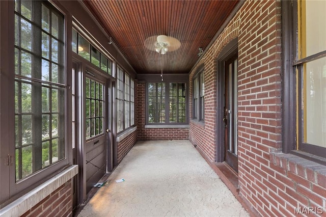870 Tuxedo Blvd, Saint Louis, MO 63119 - unfurnished sunroom with brick wall and wooden ceiling