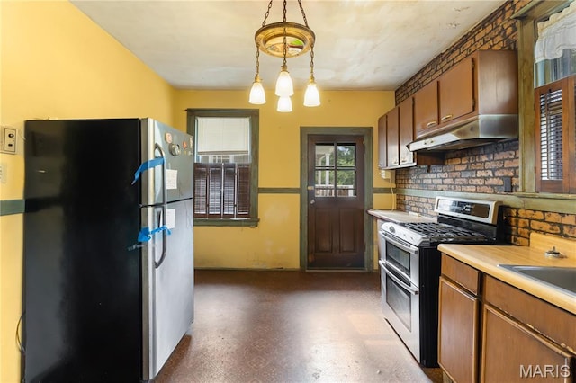 870 Tuxedo Blvd, Saint Louis, MO 63119 - kitchen featuring stainless steel appliances, under cabinet range hood, backsplash, light countertops, and dark floors