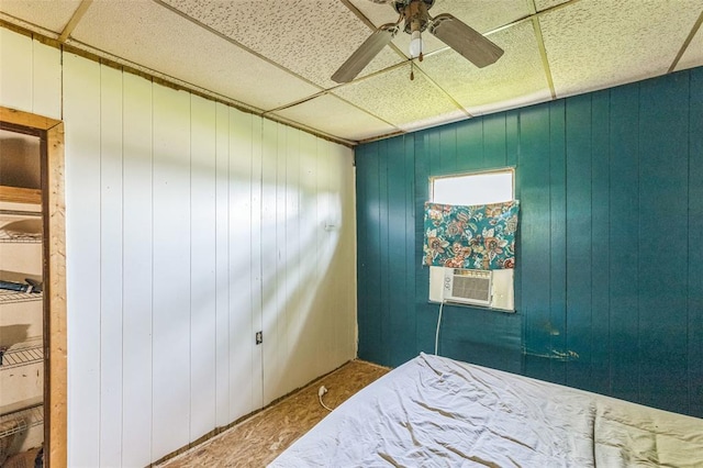 bedroom with cooling unit, a drop ceiling, ceiling fan, and carpet floors