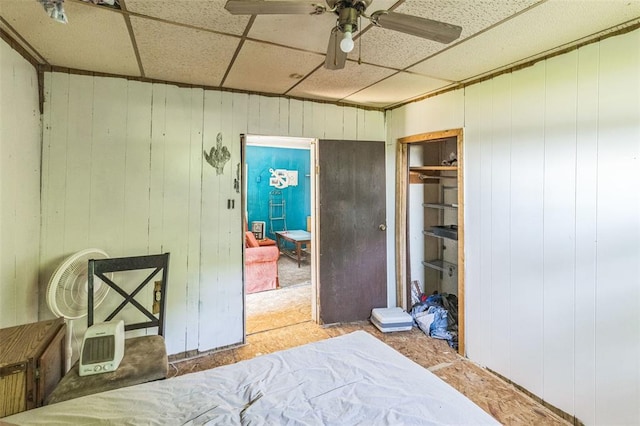 bedroom featuring a paneled ceiling and a ceiling fan