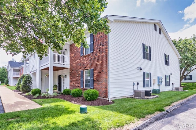 902 Hanna Place Ct Unit A, Manchester, MO 63021 - view of home's exterior featuring a lawn and brick siding