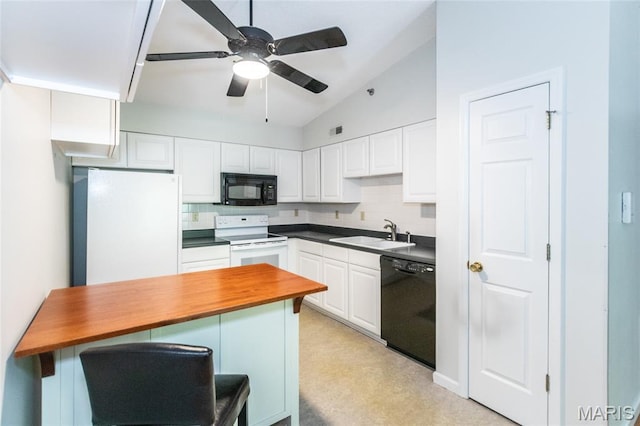 902 Hanna Place Ct Unit A, Manchester, MO 63021 - kitchen with black appliances, tasteful backsplash, white cabinetry, vaulted ceiling, and a kitchen breakfast bar