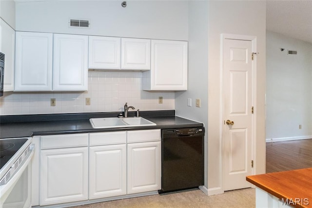 902 Hanna Place Ct Unit A, Manchester, MO 63021 - kitchen with dishwasher, electric range, white cabinetry, tasteful backsplash, and dark countertops