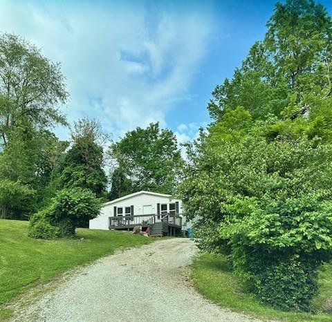 645 Isherwood Ave, Edwardsville, IL 62025 - view of front of home with driveway, a wooden deck, and a front yard