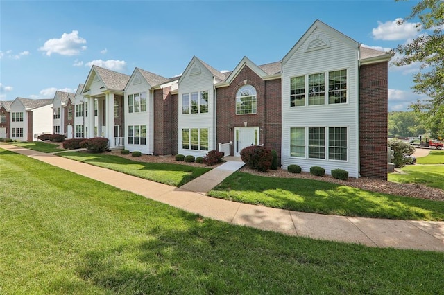 1625 Forest Springs Ln Unit A, Ballwin, MO 63021 - multi unit property featuring a front yard and brick siding
