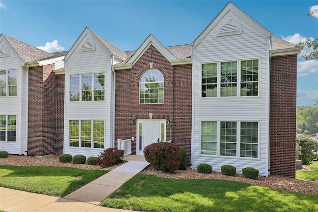 1625 Forest Springs Ln Unit A, Ballwin, MO 63021 - view of front of house featuring a front yard and brick siding