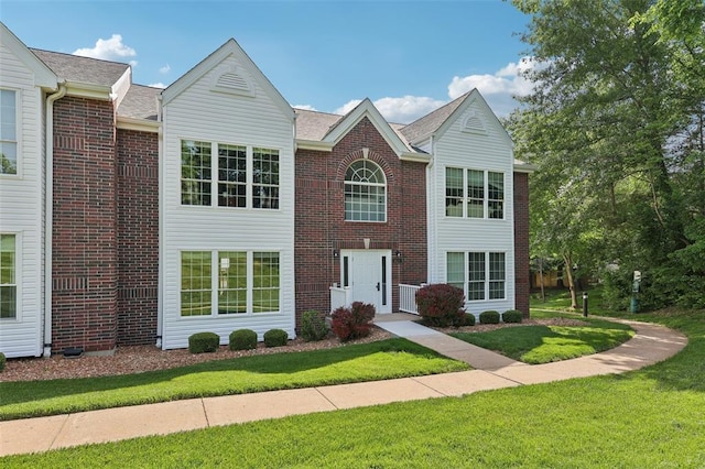 1625 Forest Springs Ln Unit A, Ballwin, MO 63021 - view of front of home featuring a front lawn and brick siding