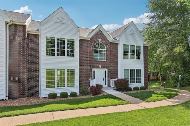 1625 Forest Springs Ln Unit A, Ballwin, MO 63021 - view of front of house featuring a front yard and brick siding