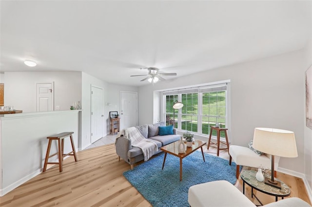 1625 Forest Springs Ln Unit A, Ballwin, MO 63021 - living area featuring wood finished floors, a ceiling fan, and baseboards