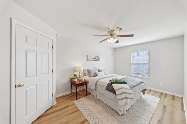 1625 Forest Springs Ln Unit A, Ballwin, MO 63021 - bedroom with light wood-type flooring, baseboards, and ceiling fan