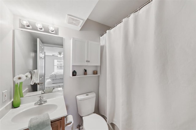 1625 Forest Springs Ln Unit A, Ballwin, MO 63021 - full bath featuring toilet, vanity, a ceiling fan, and a shower with shower curtain